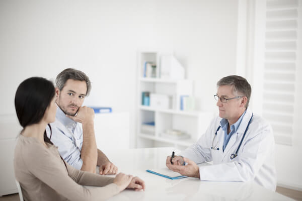 Doctor in front of a couple