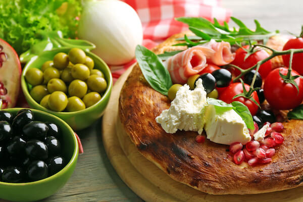 Ingredients of Mediterranean cuisine, on wooden background