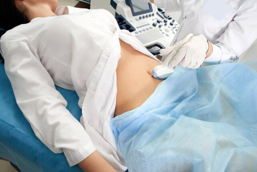 Cropped view of woman at gynecologist doing ultrasound exam.